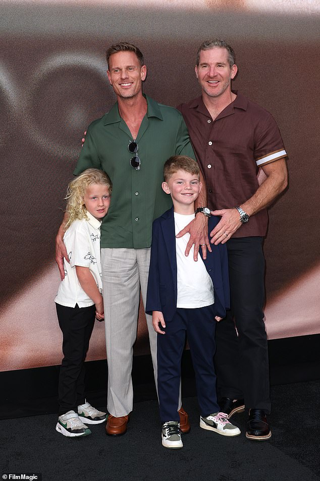 Here Christopher is seen with his partner Cody Morris and their children