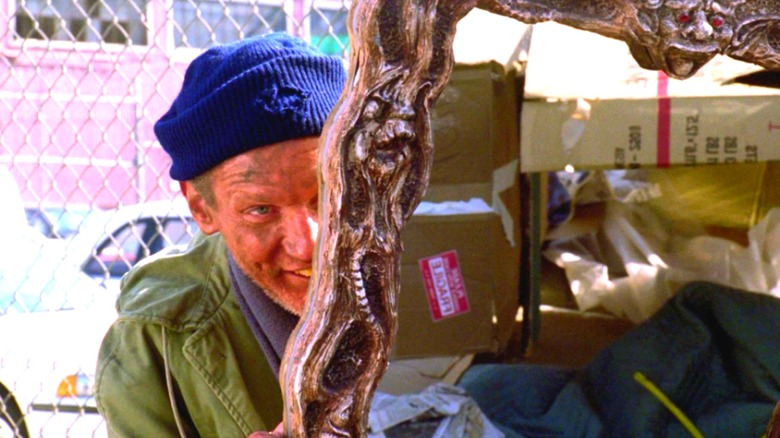 Franklin gifting Keyes a cursed mirror in Amityville: A New Generation