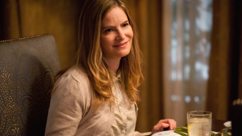 Joan smiles at dinner in Amityville: The Awakening